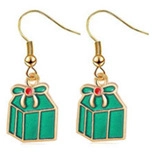 Macro view of Christmas gift box earrings with green enamel and red bow details