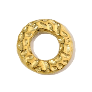 Macro shot of a golden geometric hammered texture ring pendant in durable stainless steel