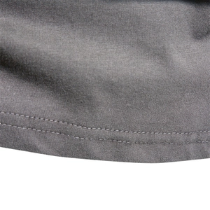 Close-up of double-stitched hem on a men's dark grey cotton long sleeve t-shirt