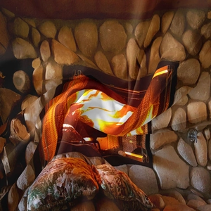 Detail of soft fabric tapestry showing realistic pebble fireplace and warm orange flames