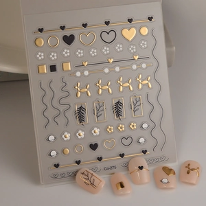 Detailed Co-275 nail decals featuring gold hearts, floral patterns and balloon dog designs