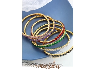 Macro shot of 18K gold plated tennis bracelets with colorful square-cut cubic zirconia