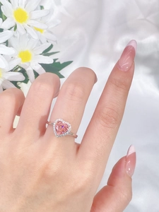 Close-up of heart-shaped pink gemstone ring in S925 silver worn by a model