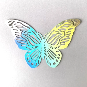 Detail of 3D hollow butterfly wall sticker with iridescent holographic rainbow effect
