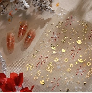Detailed view of New Year nail stickers featuring gold foil characters and fireworks patterns