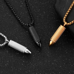 Three titanium steel bullet pendants in silver, black and gold on box chains