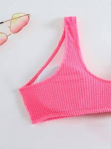 Detail of pink seersucker bikini top with removable pads and breathable mesh lining