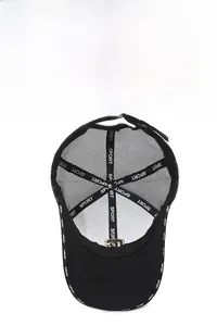 Detail of black mesh baseball cap showing interior sport seams and adjustable strap