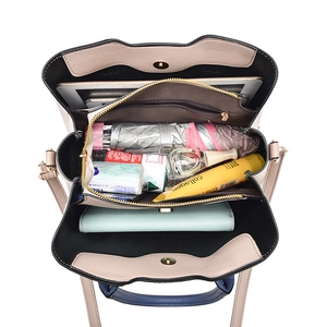 Minimalist beige PU leather tote bag showing large interior capacity and compartments