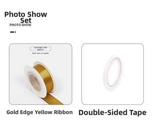 Close-up of golden edge yellow satin ribbon and double-sided adhesive tape roll