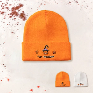 Detailed view of Halloween pumpkin embroidery on a soft knit beanie for autumn
