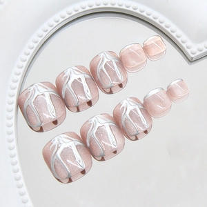 Pink cat eye press-on toenails with 3D liquid metal lines in minimalist aesthetic