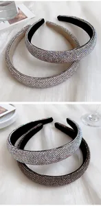 Detail view of two padded headbands with full rhinestone embellishments in silver and bronze