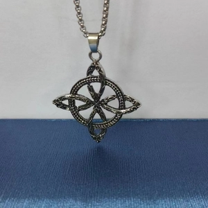 Macro view of silver Slavic necklace with intricate Viking knot pendant design