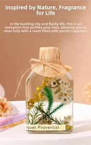 Detail of a square glass diffuser bottle with mimosa flowers and kraft paper wrap