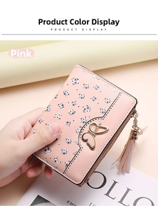 Close-up of pink floral small wallet with gold butterfly clasp and leather tassel