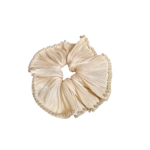 Elegant cream pleated chiffon scrunchie with white pearl trim decoration on white background