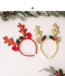 Detail of red and gold glitter reindeer antlers headbands with bells and sequins