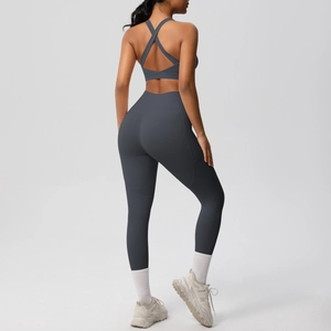 Detail view of the crisscross back straps on a charcoal grey high-impact yoga sports bra