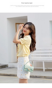 Mint green quilted jelly bag with gold lock and chain strap shown on a female model outdoors