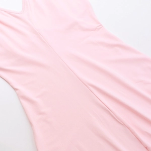 Detailed macro view of pink stretch knit fabric with ruffles and stitching of the dress