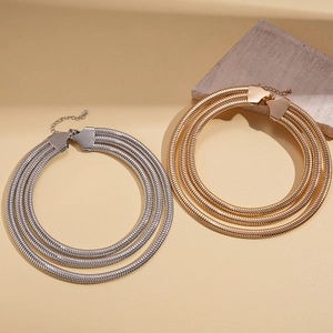 Three-layer metallic snake chain necklace in gold and silver finish with lobster clasp