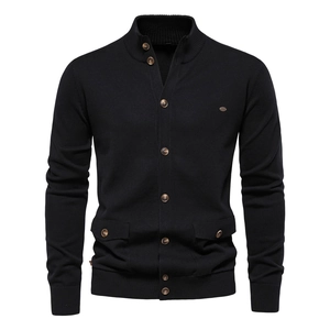 Detail of men's black knit cardigan featuring a stand collar and buttoned flap pockets