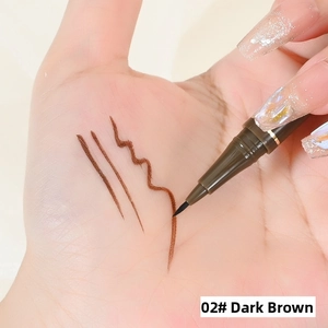 Macro shot of 02 dark brown waterproof eyeliner swatches on skin with fine tip detail