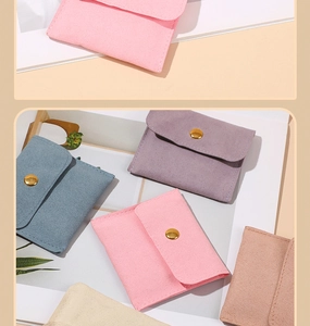 Detail showing colorful microfiber jewelry pouches with gold snap button closures