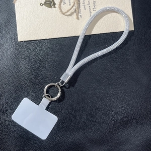 Silver glitter woven phone wrist strap with metal buckle and clear connector pad