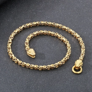 Golden Byzantine king chain necklace for men featuring twin snake heads and ring clasp