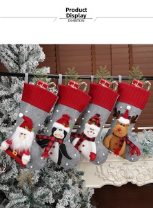Detail of Christmas stocking 4-pack featuring Santa, Penguin, Snowman and Reindeer applique
