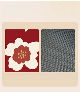 Detail of red floral bath mat showing non-slip rubber backing and soft velvet surface