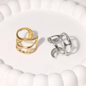 Irregular hollow open ring in gold and silver finish with fluid minimalist design