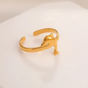 Detail of adjustable gold-tone stainless steel ring featuring a sleek dolphin design