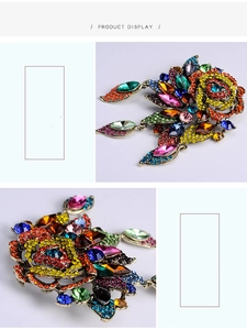 Detailed macro view of vintage baroque brooch with colorful rhinestones and alloy base