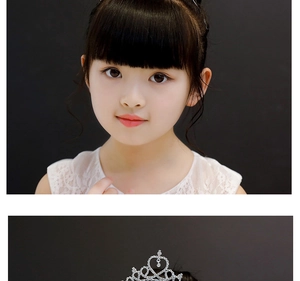 Close-up of a silver princess crown hairband with heart rhinestones on a young girl