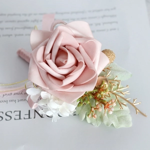 Pink PE rose boutonniere with silk ribbon and gold berry accents for wedding attire