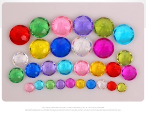 Macro shot of colorful acrylic crystal diamonds in various sizes and faceted cuts