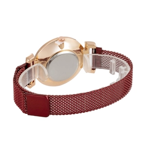 Close-up of women's red Milanese strap watch with rose gold case and magnetic buckle back