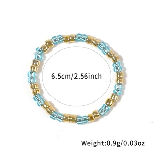 Handmade blue and gold seed bead elastic ring with 6.5cm diameter and 0.9g weight