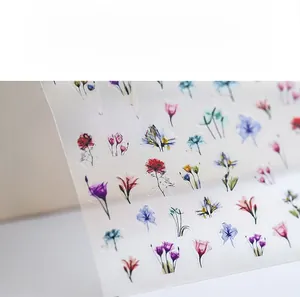 Detailed view of Hazy Flowers 5D nail stickers featuring red roses and blue wildflowers