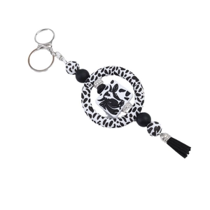 DIY silicone beaded keychain with black white cow pattern beads and cute cow charm