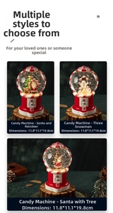 Detail view of musical Christmas snow globes in vintage candy machine design