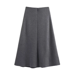 Detailed texture of gray knit midi skirt with elegant drape and soft A-line silhouette