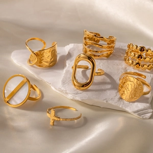 Minimalist gold stainless steel ring set with cross and pearl details on stone