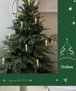 Close-up of LED Christmas candle lights with warm yellow glow and tree clips