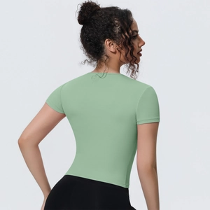 Detailed back view of slim fit light green yoga t-shirt with breathable athletic fabric