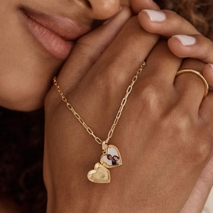 Minimalist gold plated heart locket necklace with zircon inlay and interior photo detail