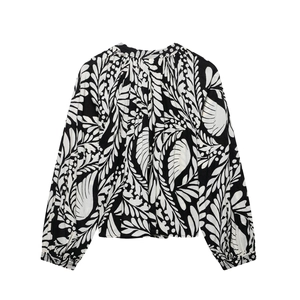Women's floral print blouse with mandarin collar and black leaf patterns on white fabric
